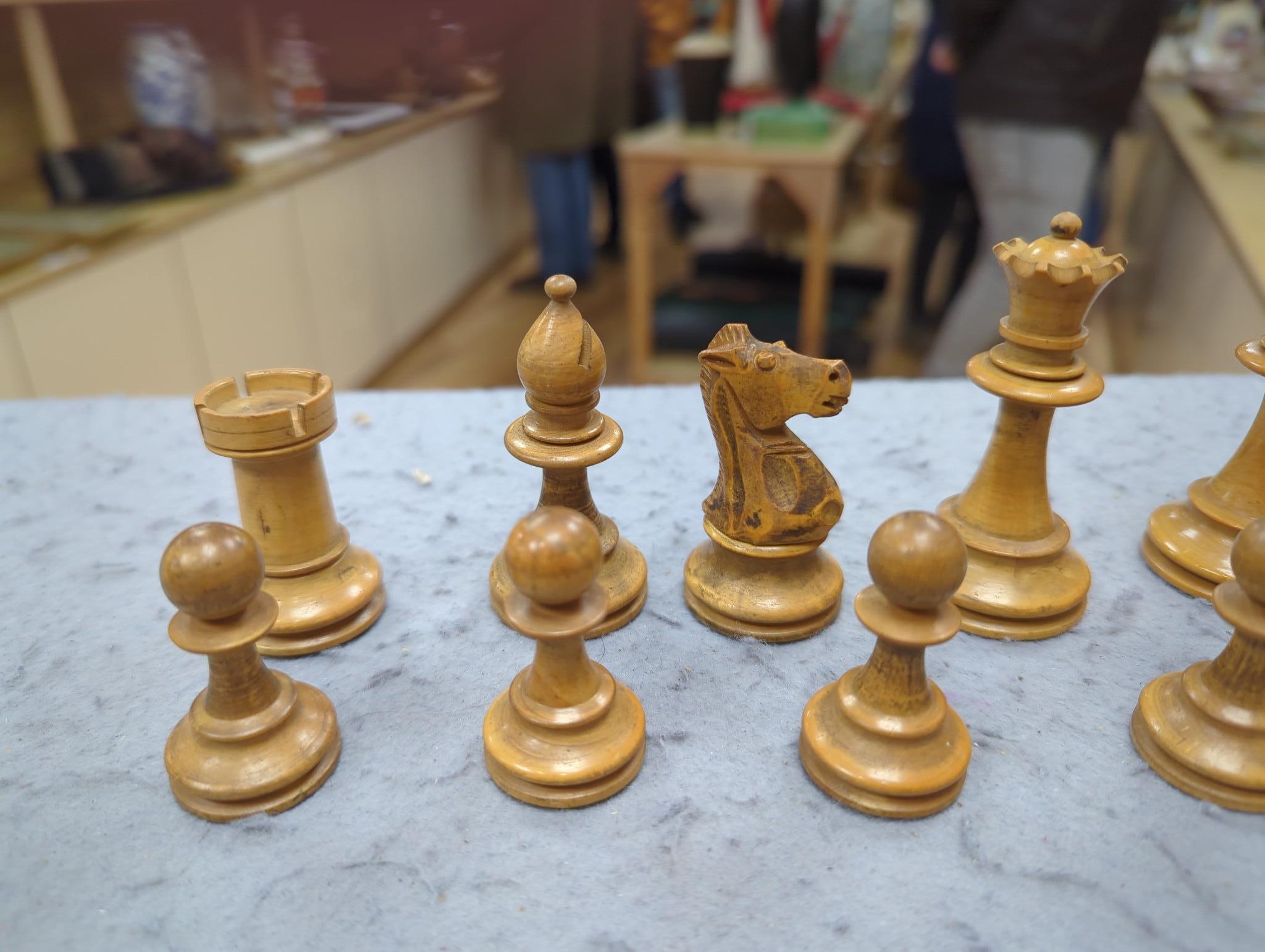 After Mene, a bronze greyhound, a Staunton-pattern chess set and a set of Victorian postal scales, bronze 22cms wide